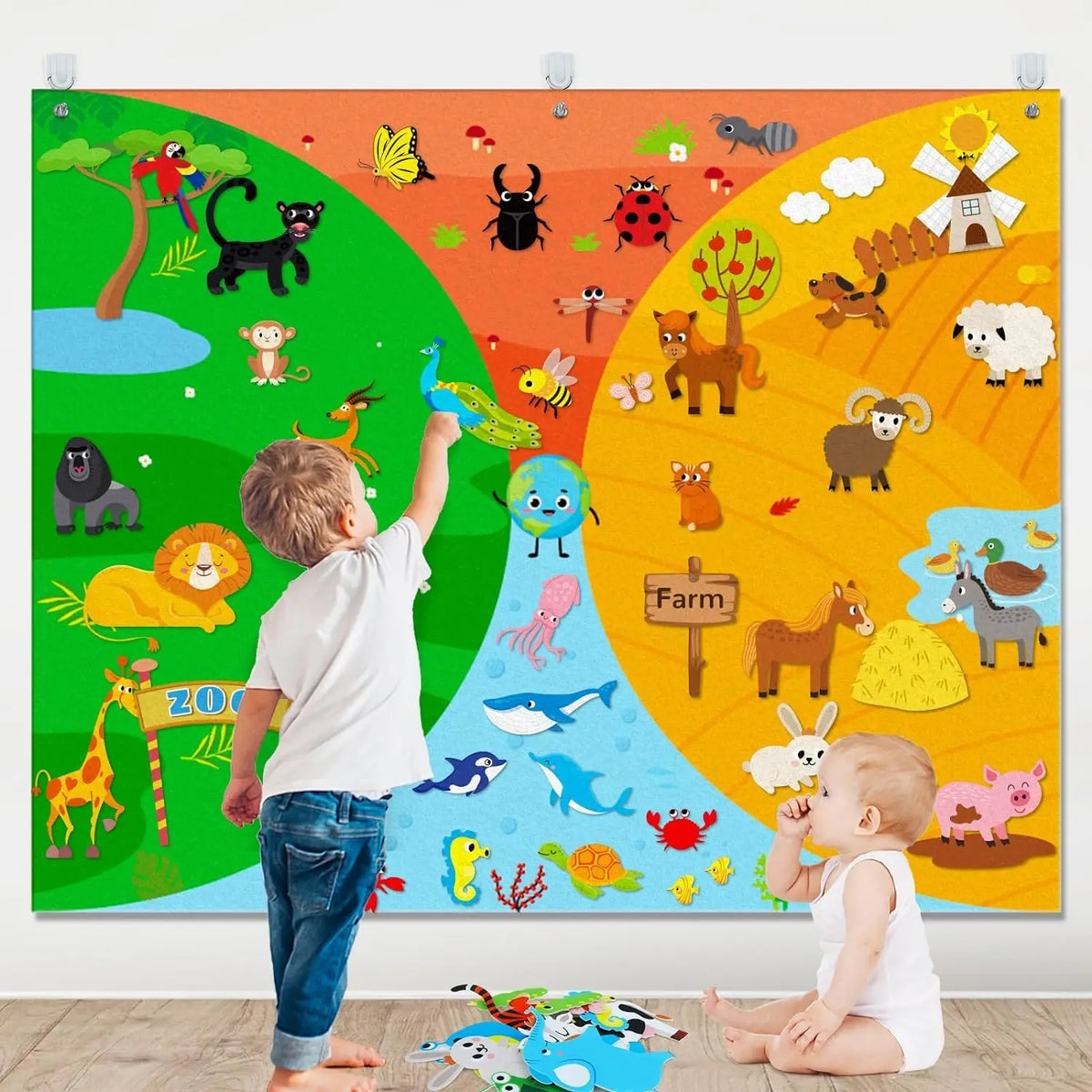 A child stands in front of a colorful felt board featuring various farm animals and nature scenes.