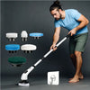 A man is using a cordless electric spin scrubber with interchangeable heads on a floor, demonstrating its cleaning capabiliti