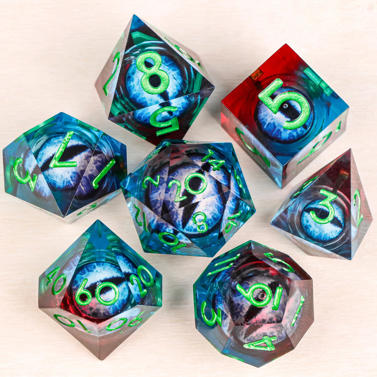A set of liquid core resin dice featuring a dragon eye design in various colors and angles.
