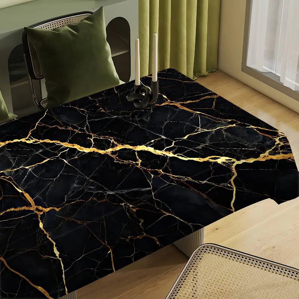 Black gold marble waterproof tablecloth displayed on a wooden table with candles.