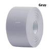 Gray self-adhesive waterproof sealing tape rolled up for sealing gaps in sinks, bathrooms, and windows.