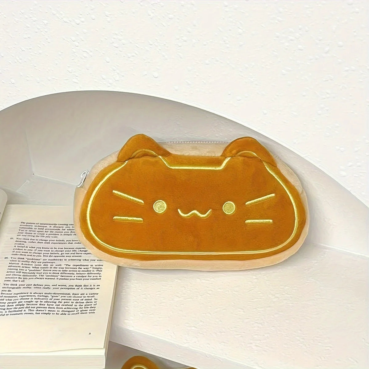 Caramel cat plush pencil case with large capacity shown in a light beige color.