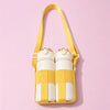 A yellow breathable mesh crossbody water bottle carrier holding two white water bottles.