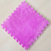 A square mat of bright purple soft plush interlocking floor tiles.