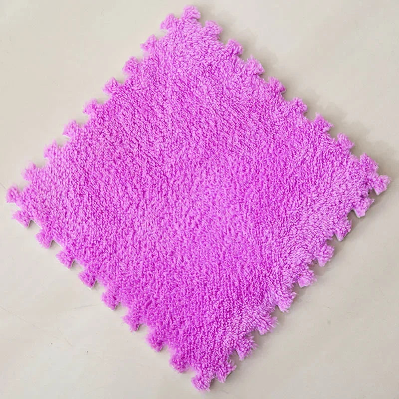 A square mat of bright purple soft plush interlocking floor tiles.