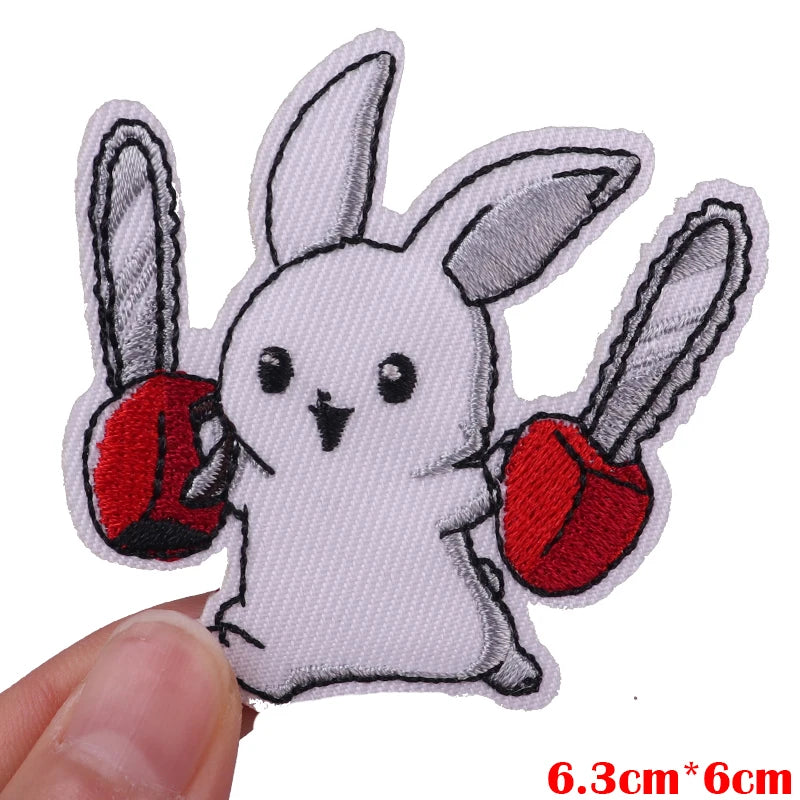White cartoon rabbit embroidered iron-on patch with red accents