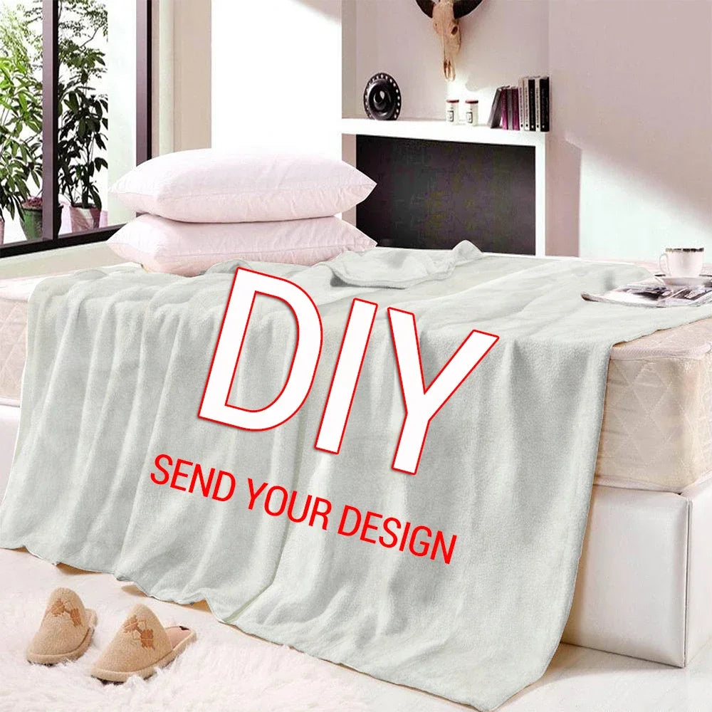 A light gray flannel throw blanket with a DIY design print displayed on a bed.