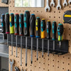 Wall-mounted organizer rack holding various hand tools like pliers, screwdrivers, and wrenches.