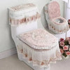 A set of antibacterial toilet seat covers featuring a washable cushion and lace trim in pink and white.
