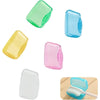 A collection of ten clear and colored plastic caps for a portable toothbrush head protector.