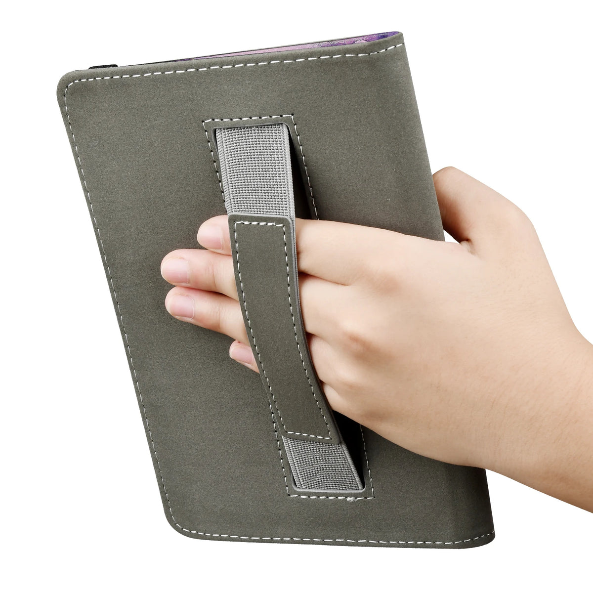 A hand is holding a dark olive green e-reader case with a strap for protection.