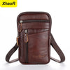 A brown vintage leather multi-pocket waist bag with a zipper and adjustable strap.