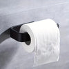 A white roll of toilet paper is mounted on a black holder against a gray wall.