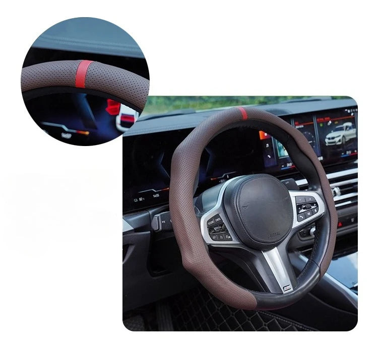 Close-up view of a perforated leather steering wheel cover with red stitching on a car interior.