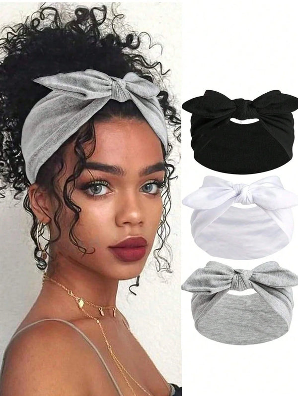 A set of bohemian bow and rabbit ear wide headband accessories in black, white, and gray.