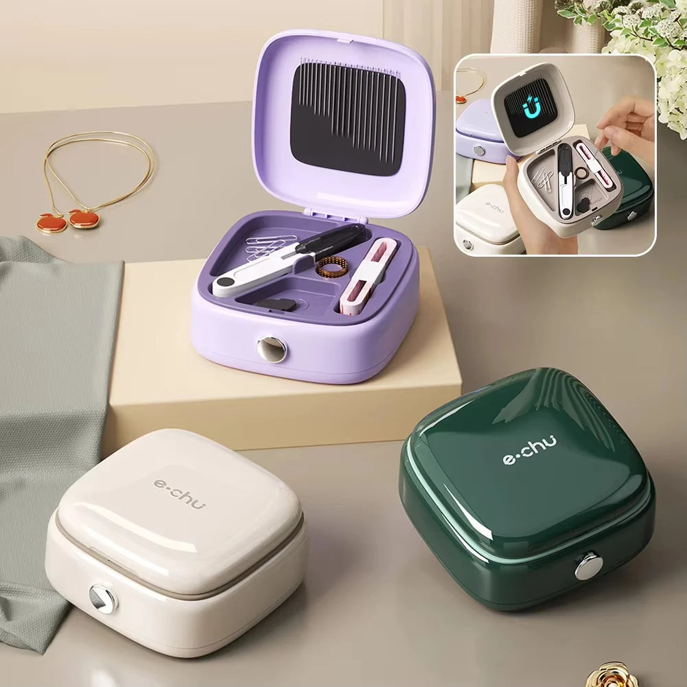 A purple compact magnetic sewing kit with needles and thread colors is displayed on a light wooden surface.