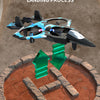 A black and blue remote control fighter plane is shown hovering above a circular terrain map.
