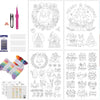 A set of four water-soluble embroidery stabilizer sheets and various needle tools for Christmas embroidery projects.