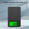 A black pocket digital scale with a green backlit LCD display showing 0.00 and a weight unit indicator.