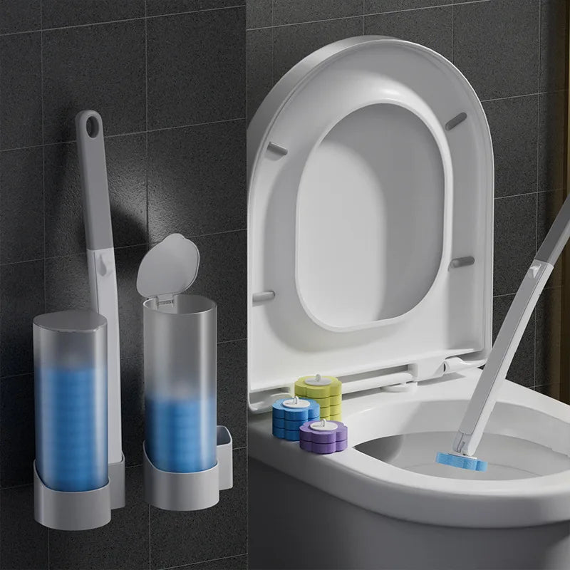 A wall-mounted disposable toilet brush set with replaceable heads is shown next to a toilet bowl.
