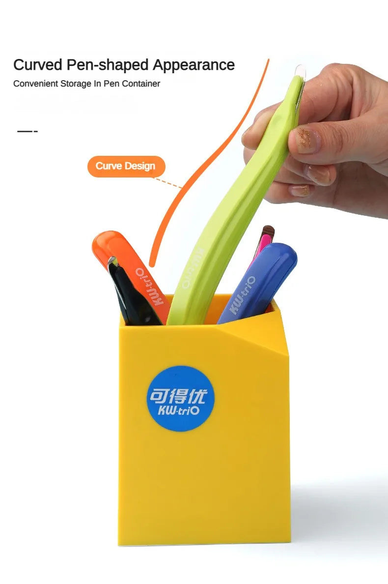 A yellow container holds various colored pens and a magnetic staple remover pen with an ergonomic grip.