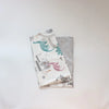 A stack of soft cotton baby pillowcases featuring watercolor cartoon animals in teal, pink, and gray.