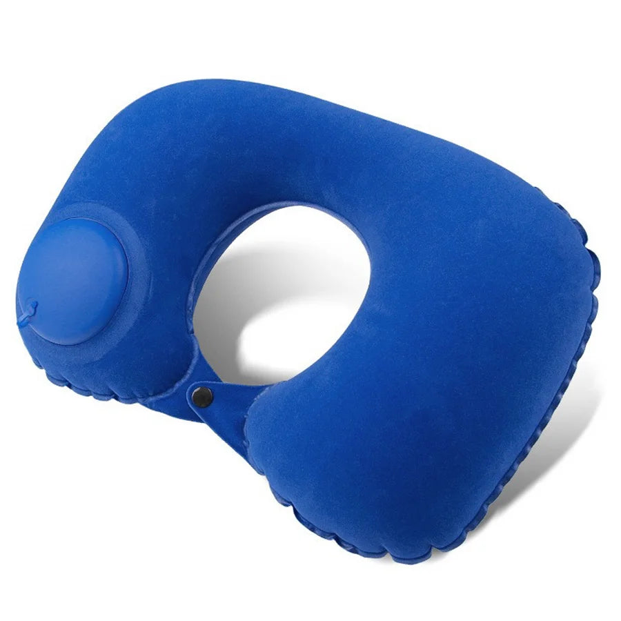 A bright blue self-inflating travel neck pillow with a soft flocking cover.