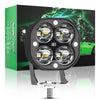 A black LED spotlight with four circular lenses is displayed in front of a box featuring an off-road vehicle.