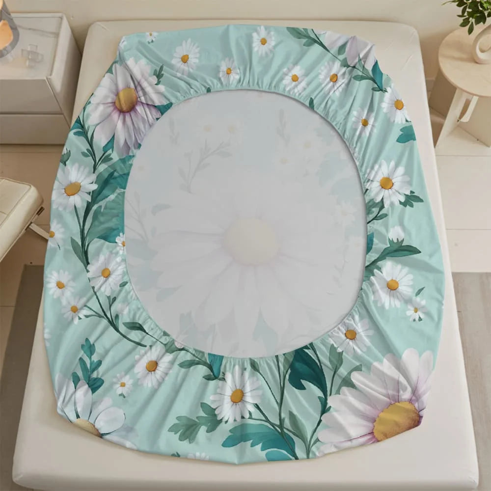 A white daisy print fitted sheet with a deep pocket displayed on a white bed frame.