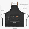 Black adjustable polyester kitchen apron with a pocket and adjustable neck strap