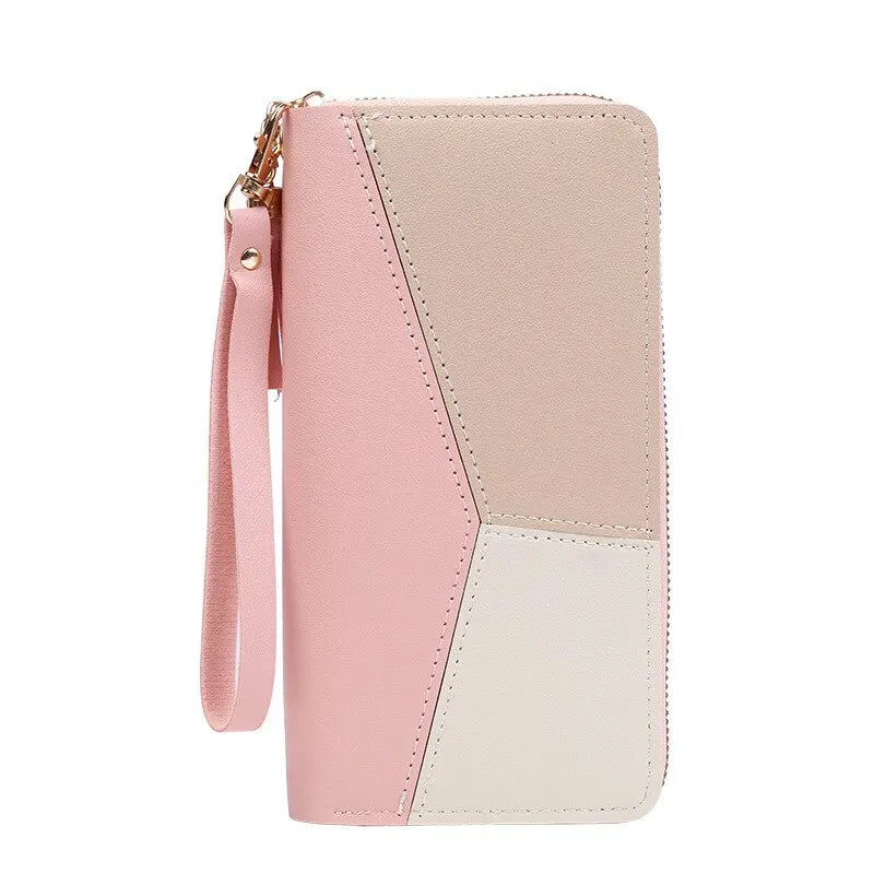 A light pink and cream colored women's long zip-around PU leather wallet with card slots.