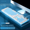 A blue and white mechanical keyboard with a liquid silicone thickened bottom plate is shown on a dark surface.