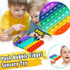 A colorful push bubble fidget toy with rainbow colored bubbles being played with by children.