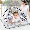 A mother is shown using a baby play gym and activity mat with hanging toys for a baby.