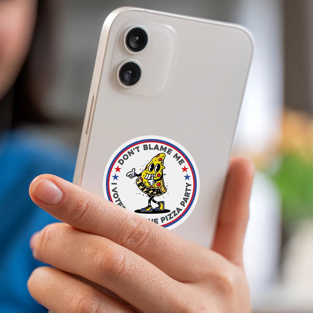 A hand holds a white smartphone displaying a funny meme sticker featuring a yellow pizza character.