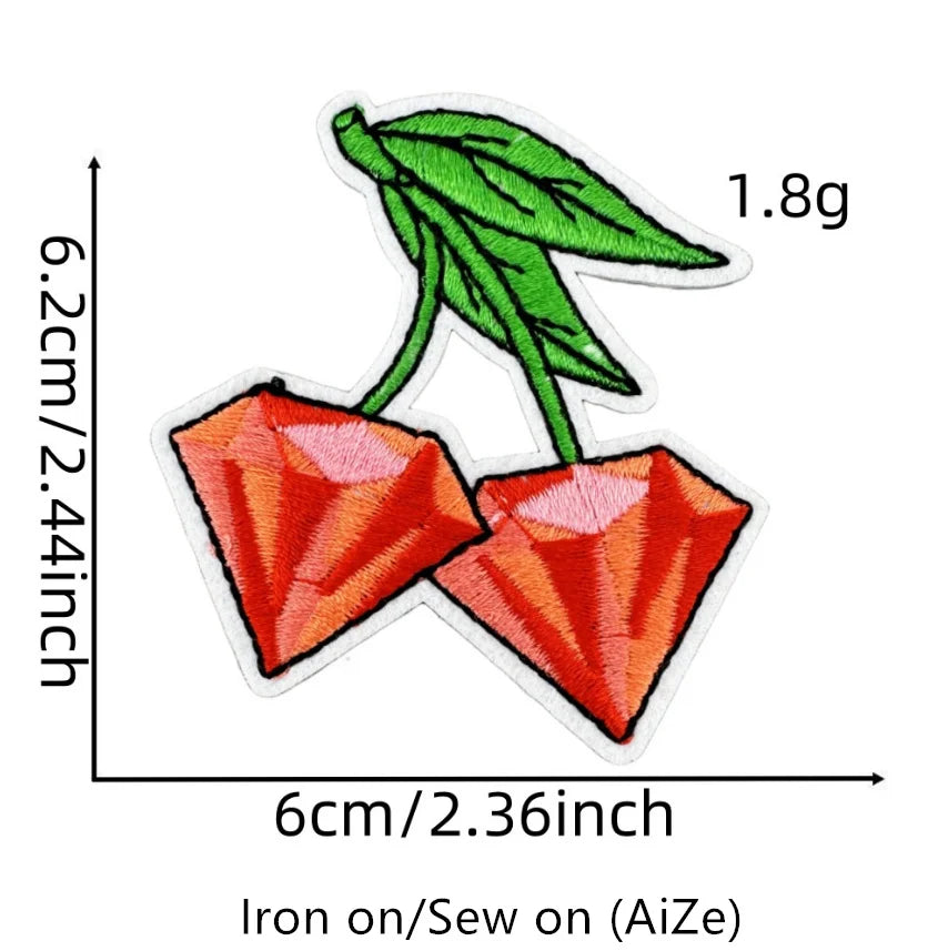 A green leaf and a red cherry fruit embroidered patch measuring 6cm wide and 2.44 inches high.