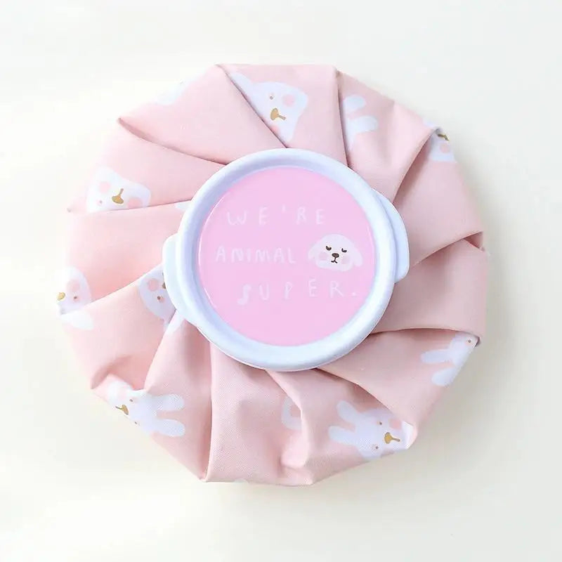 A pink reusable multi-use ice and heat therapy pack with a white lid featuring the text We're animal super.