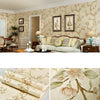 Roll of 3D embossed floral self-adhesive wallpaper featuring delicate botanical designs on a light background.