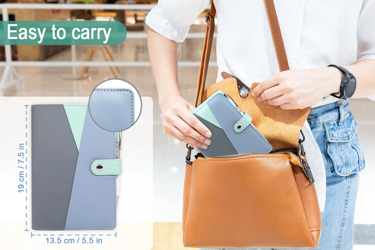 A person is carrying a brown leather budget binder with cash envelopes and a light blue folder.