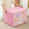 A pink foldable storage bag with a cute rabbit design is being held by a person.