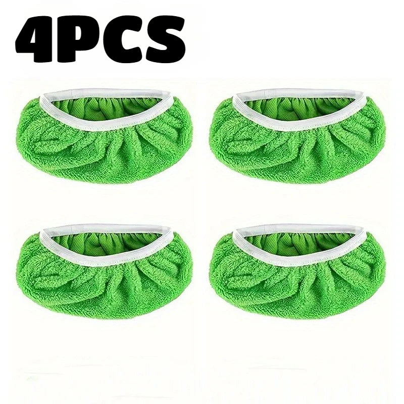 Four reusable green microfiber mop refill pads with white trim.