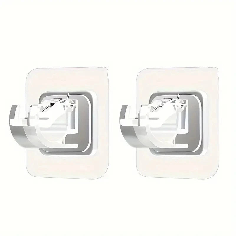 A pair of white adhesive curtain rod hooks designed for no-drill wall mounting.