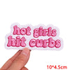 Pink embroidered patch with the text hot girls hit curbs on a white background