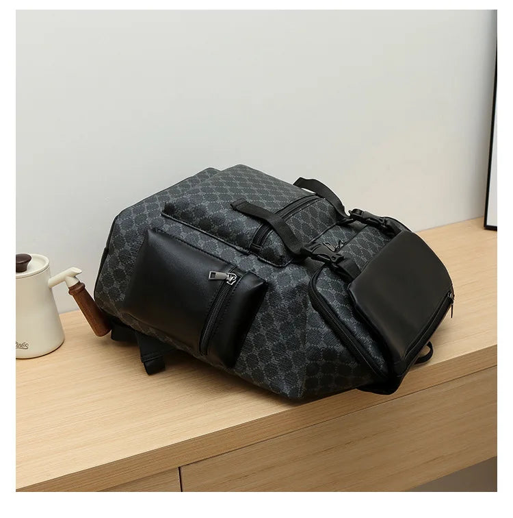 A black patterned PU leather backpack resting on a wooden surface.