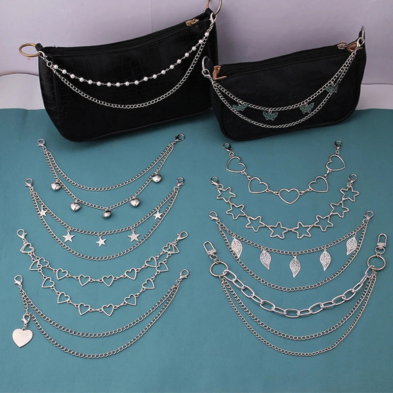 Black leather purse with multiple silver chain straps and pendant charms