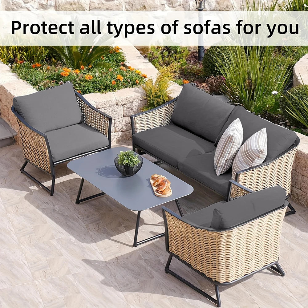 A set of grey stretch patio sofa covers for outdoor seating arranged on a paved patio.