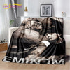 A dark photographic print of Eminem and 2Pac featuring their faces and hands, displayed as a throw blanket.