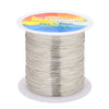 A spool of thin, silver-colored copper clad steel wire for crafting and jewelry making.