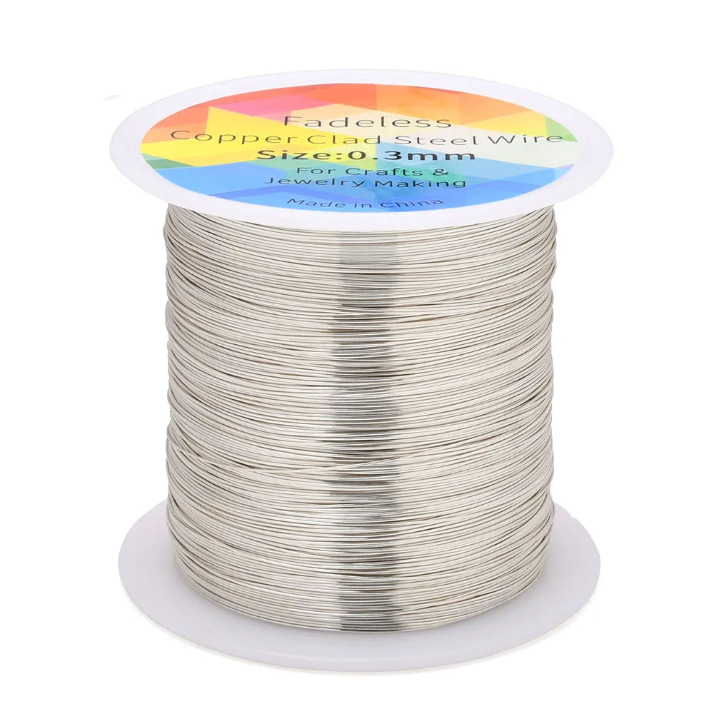 A spool of thin, silver-colored copper clad steel wire for crafting and jewelry making.