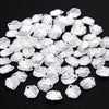 A pile of 100 clear acrylic pearl spacer beads for jewelry making